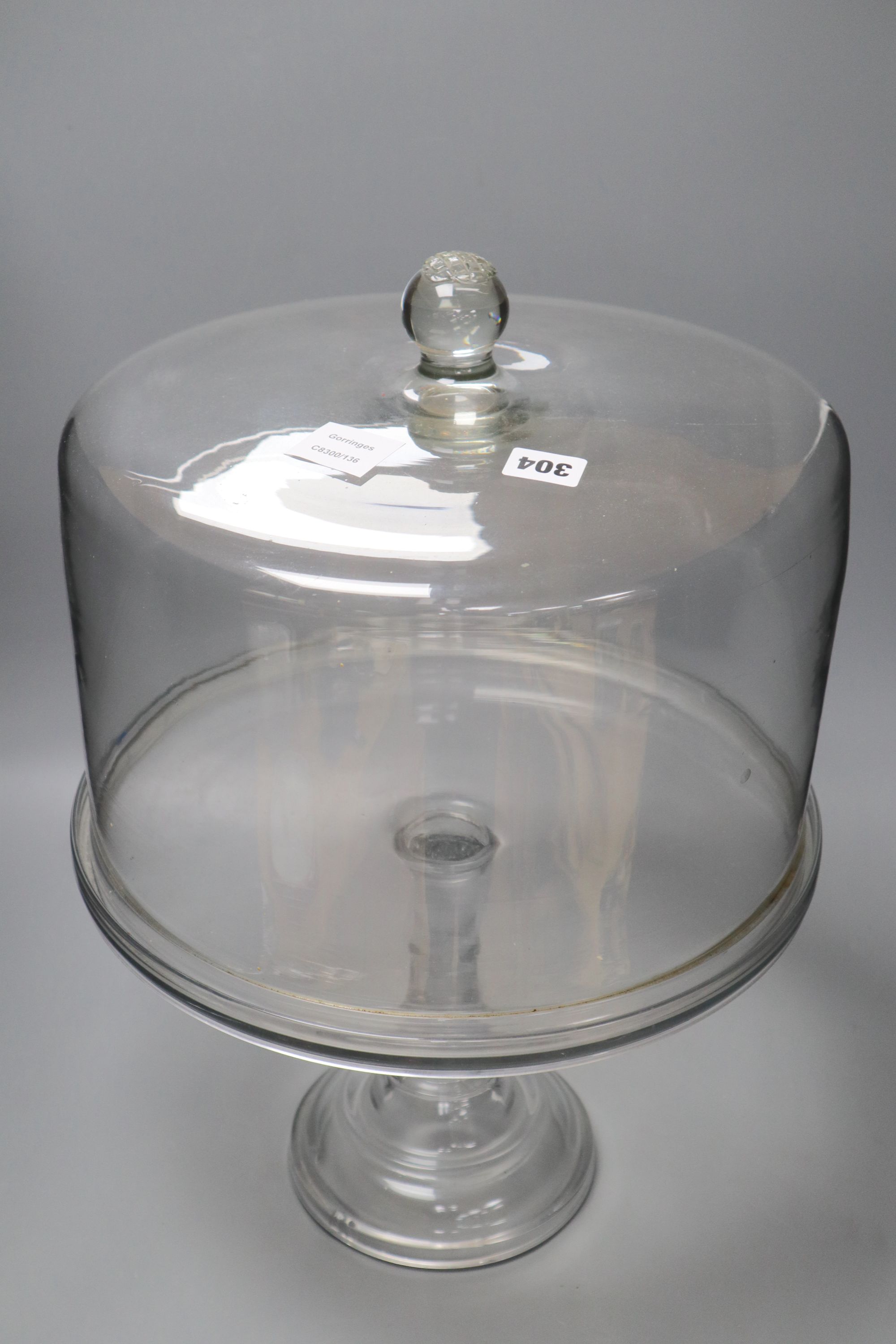 A Victorian glass pedestal cake stand and cover, height 53cm
